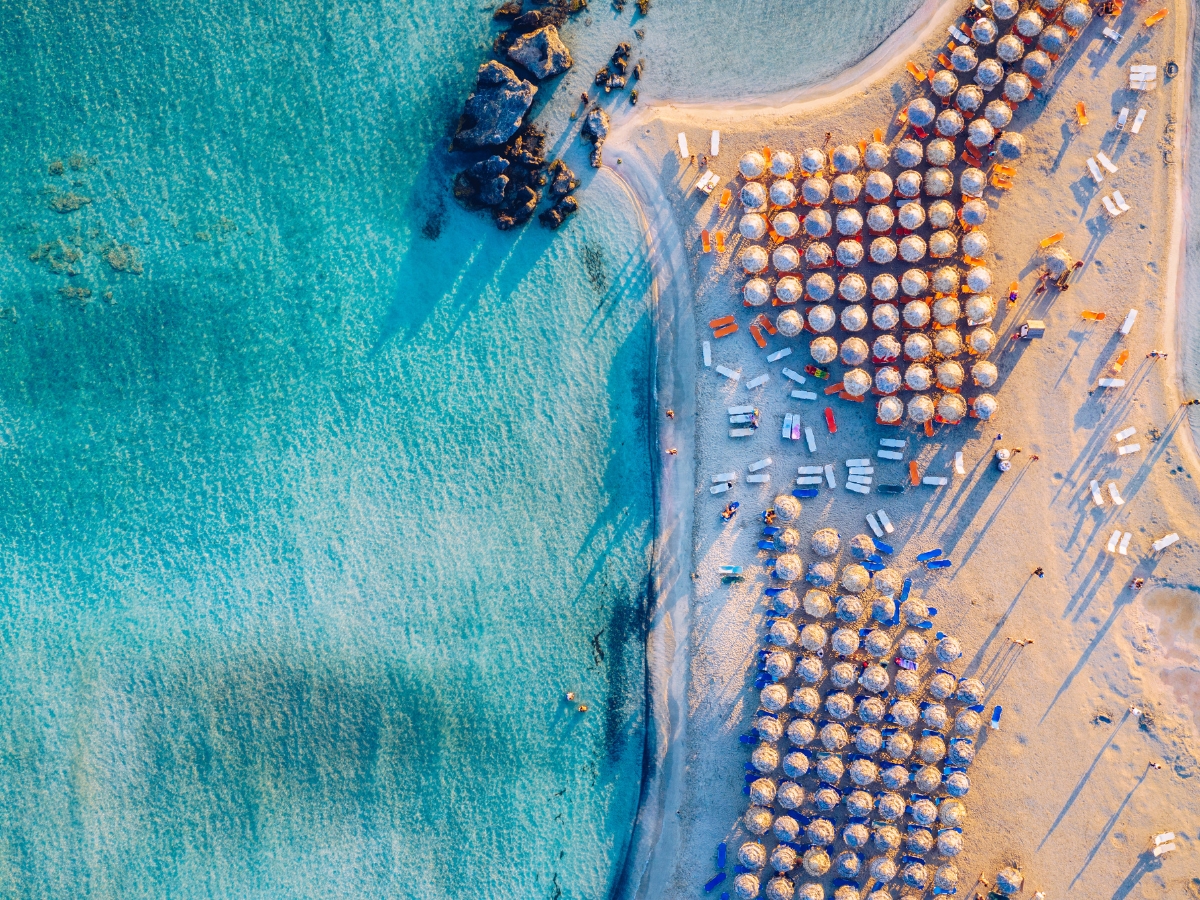 pink-sand-at-elafonissi-umbrellas-aerial-view-holidays-for-solos-at-mistral-hotel-crete-greece