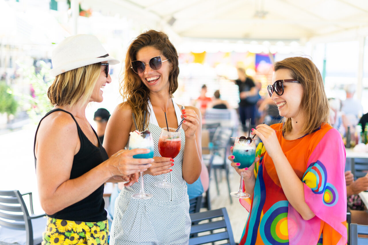 Solo-holiday-makers-at-the-Mistral-hotel-in-Crete-women-having-fun-singles-hotel-drinking-cocktails-summer-party-outdoor-bar-vacation-for-solo-travellers