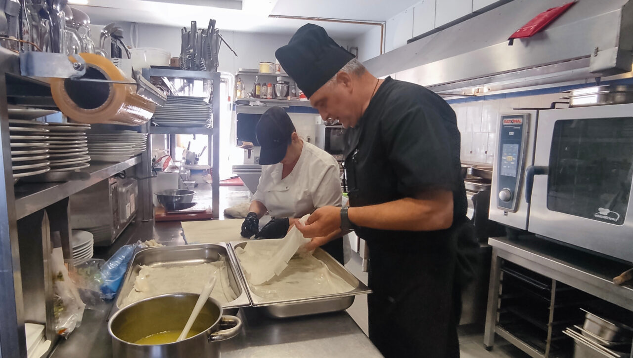 preparing-food-at-the-mistral-kitchen-hotel-singles-in-crete-solo-travel-greece-holidays-singles-solos